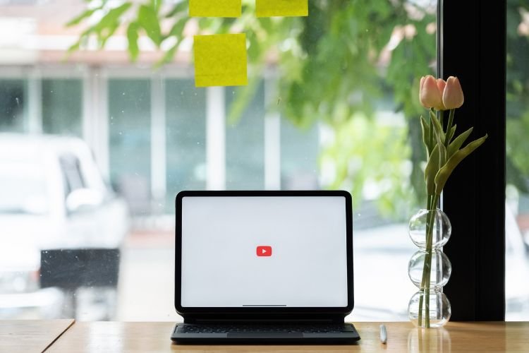 YouTube logo on a laptop screen